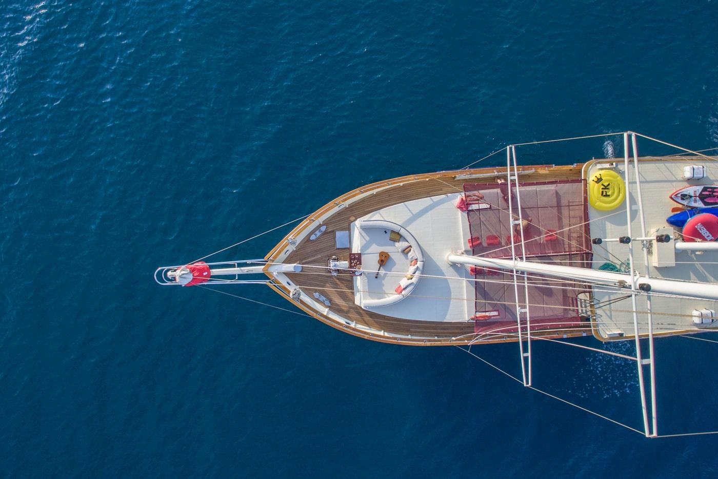 Aerial view of luxury yacht foredeck with teak decking and circular seating area