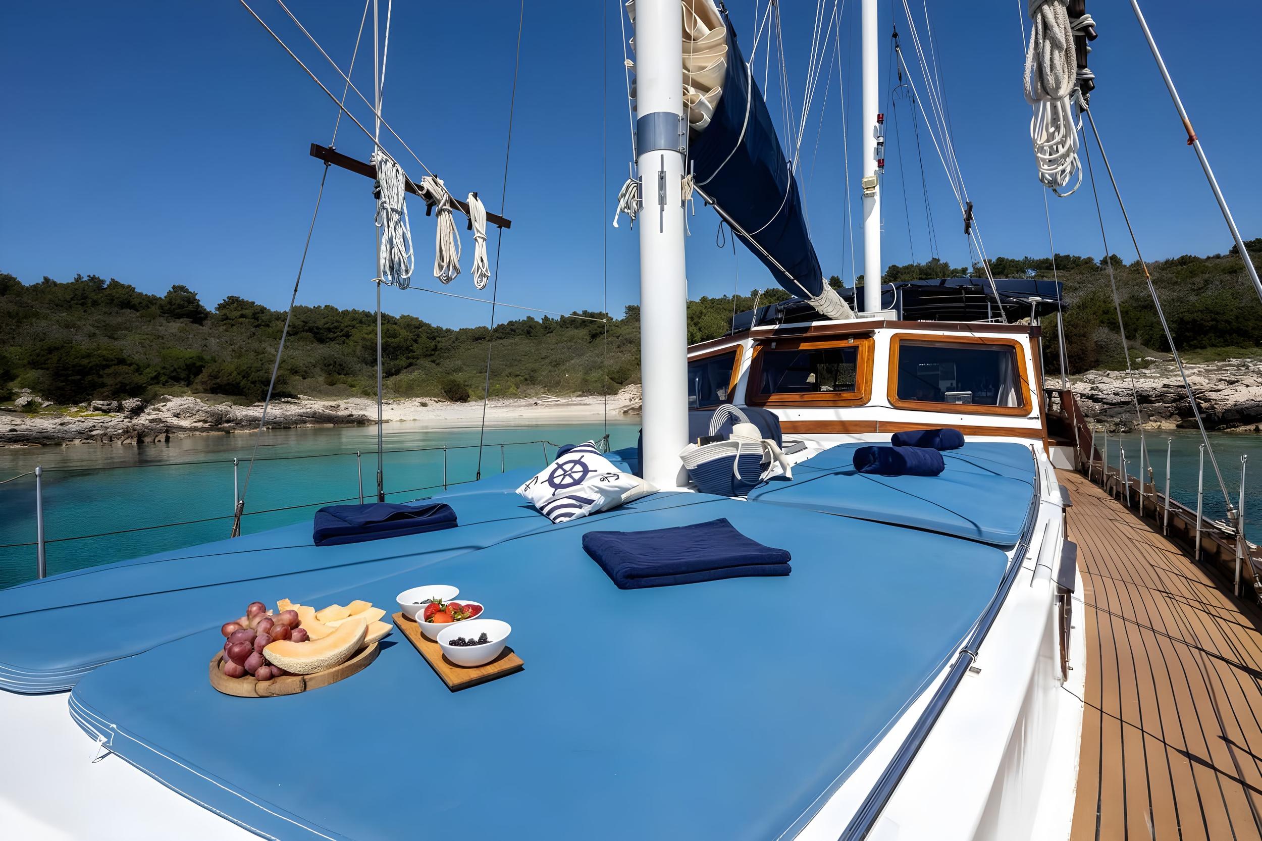 fresh fruit platter and olive bowl served on blue deck dining area