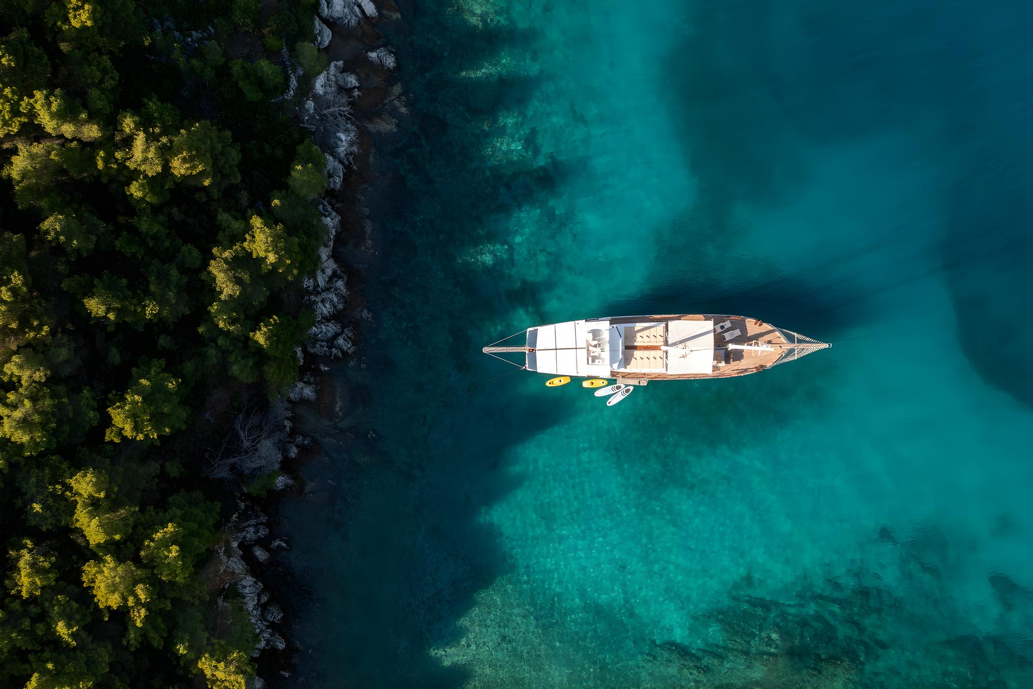 aerial view luxury gulet yacht anchored crystal clear turquoise water