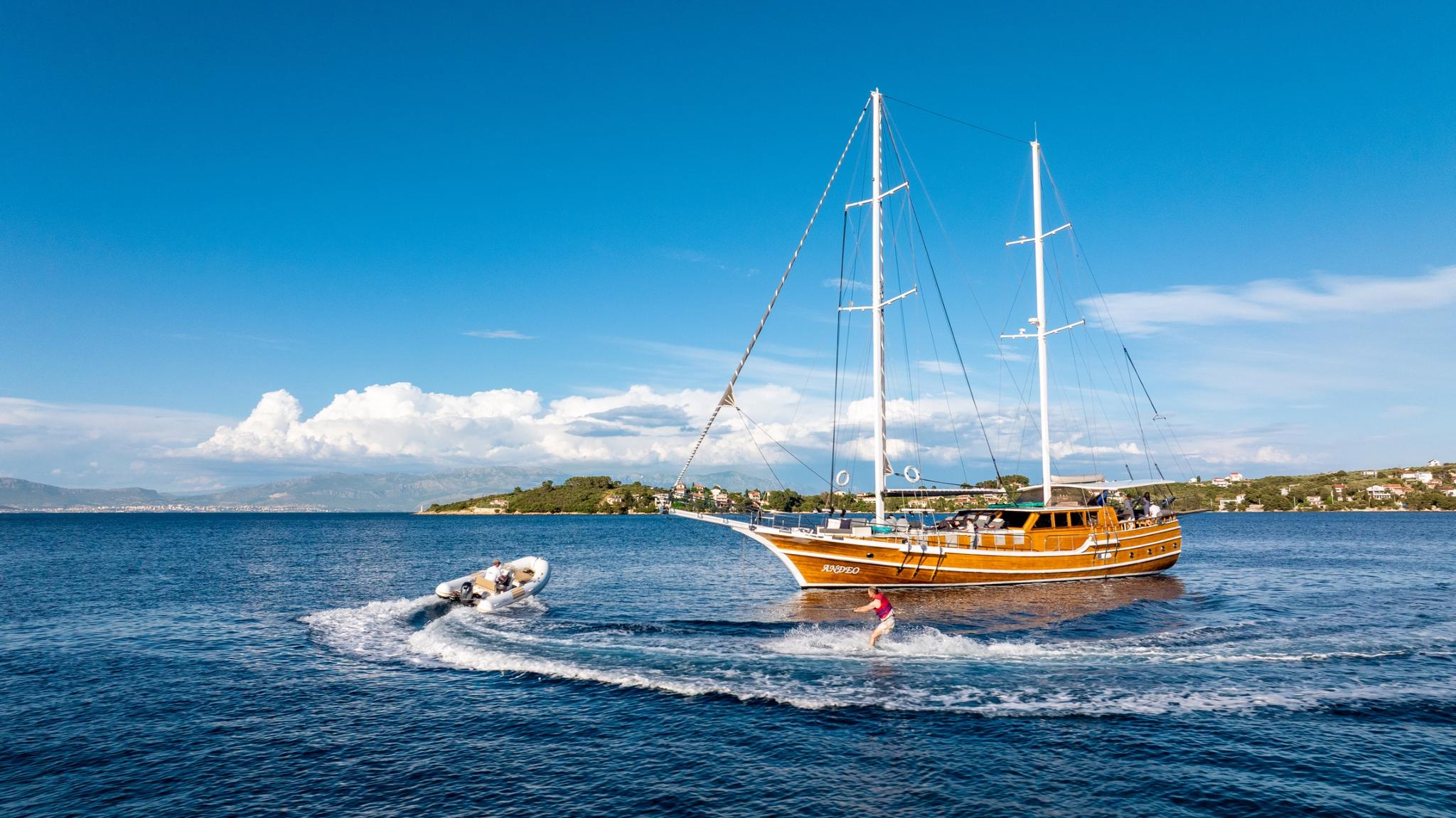 water skiing and tender boat activities from traditional wooden gulet yacht