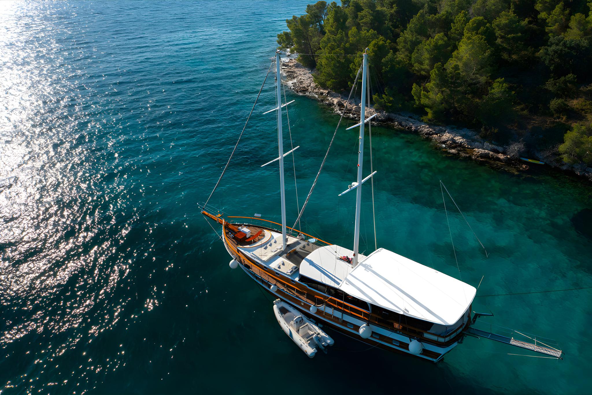 aerial view traditional wooden gulet yacht anchored crystal clear turquoise waters