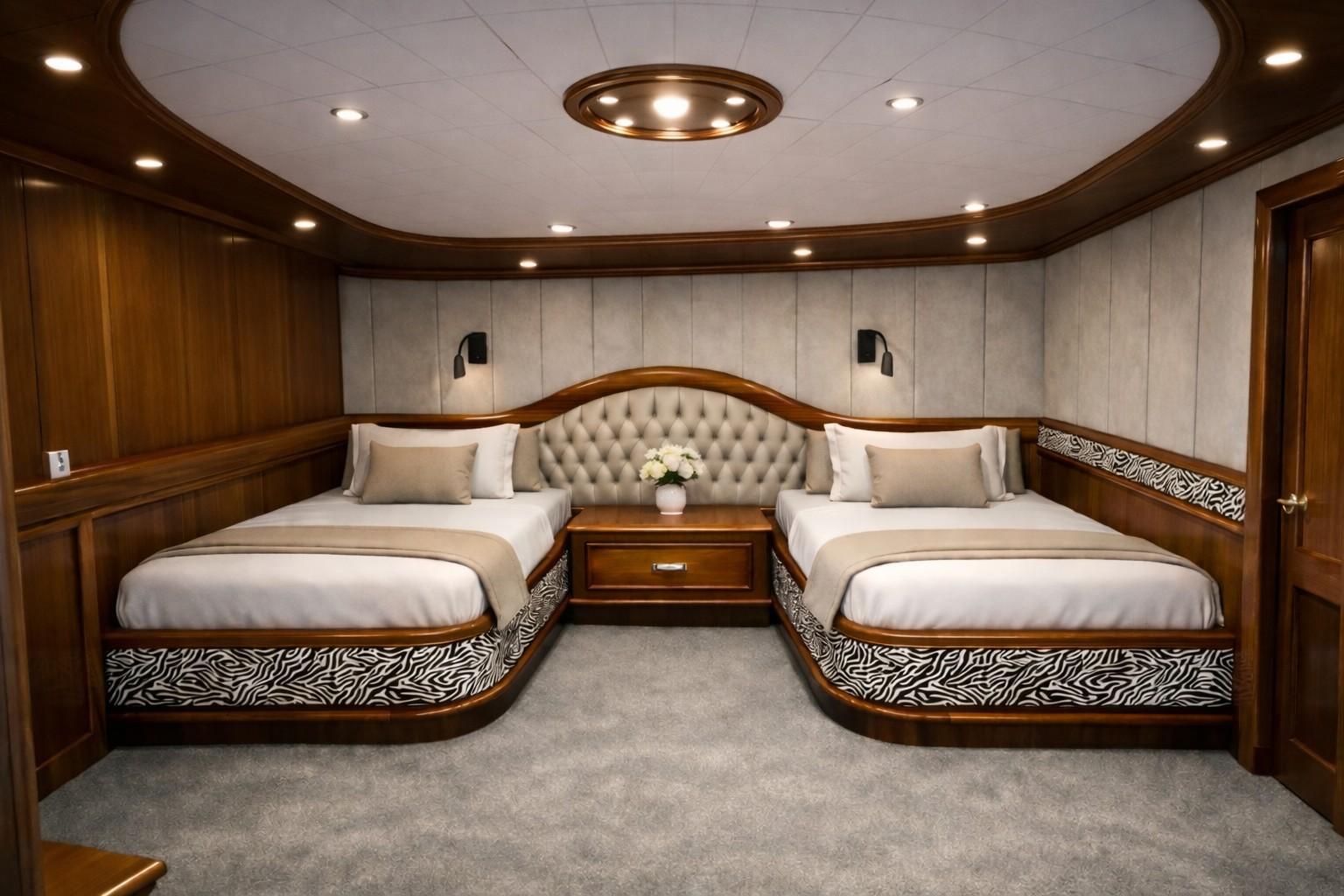 yacht twin cabin featuring two single beds with tufted headboard and wood paneling