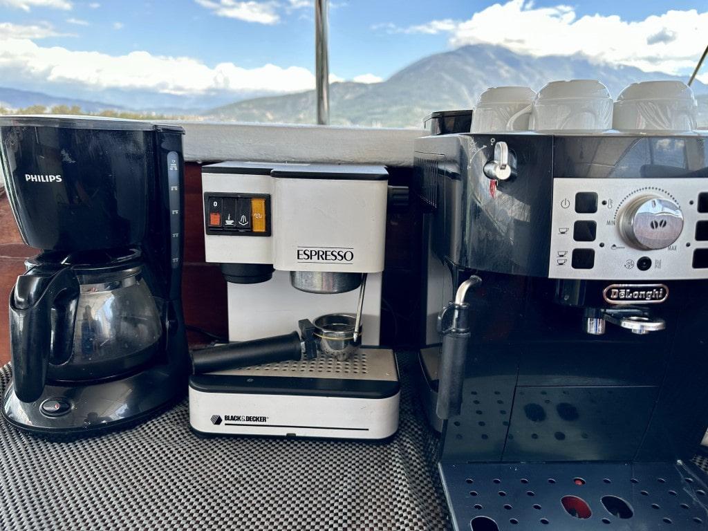 yacht galley coffee station featuring Philips drip coffee maker Black Decker espresso machine and DeLonghi unit