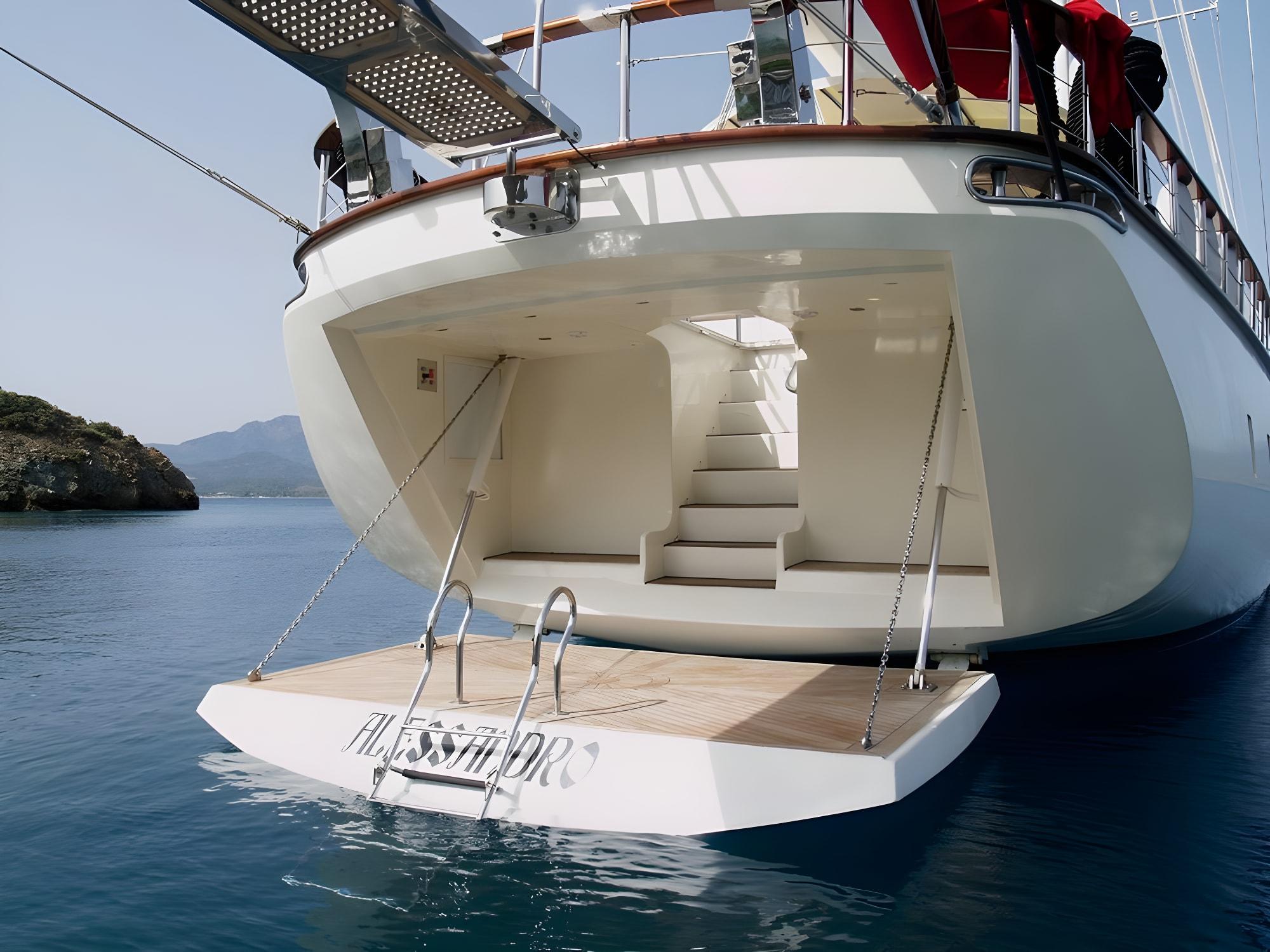 luxury yacht swimming platform with teak decking and stainless steel ladder for sea access