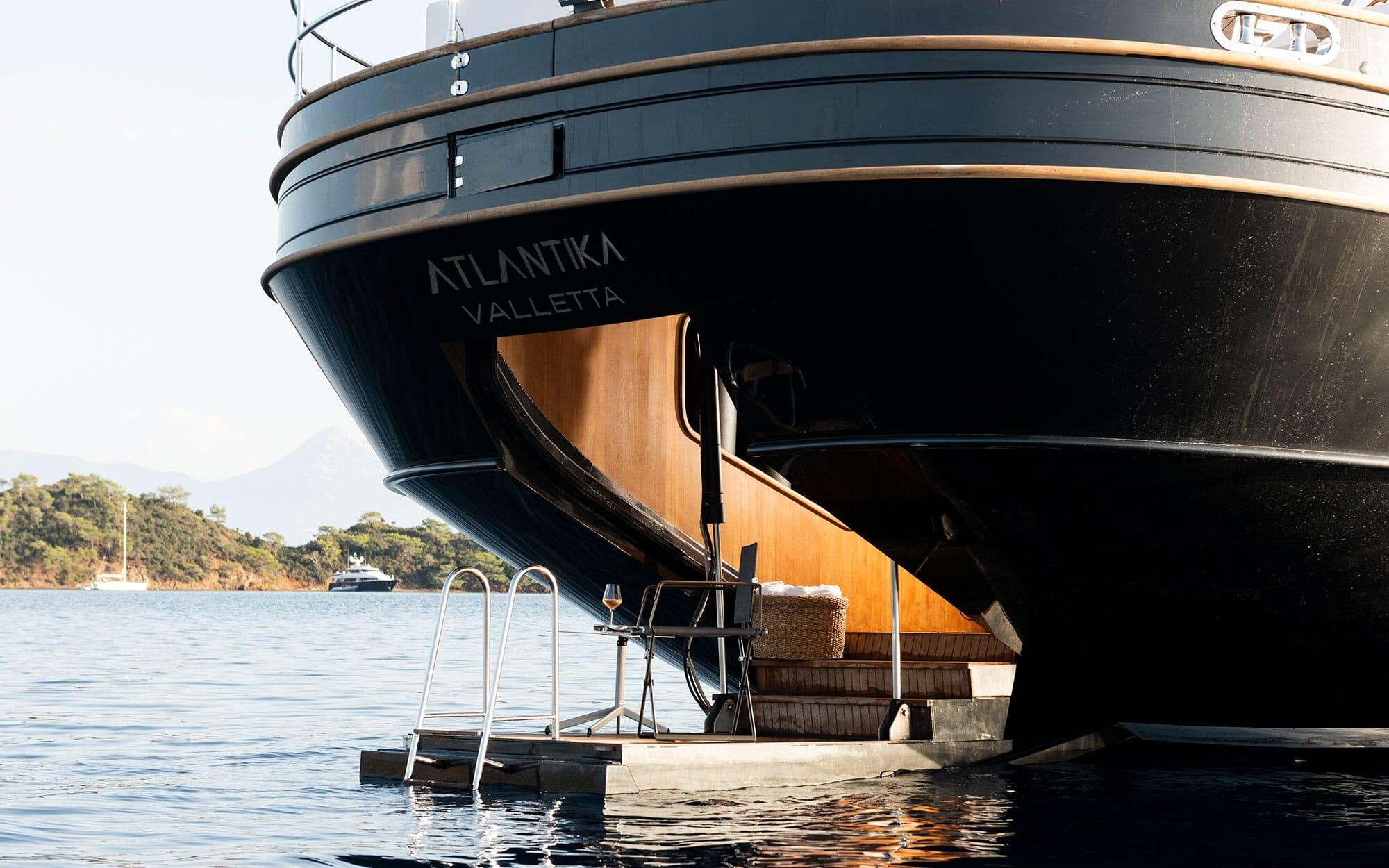 Atlantika yacht swim platform with stainless steel ladder and tender docking area