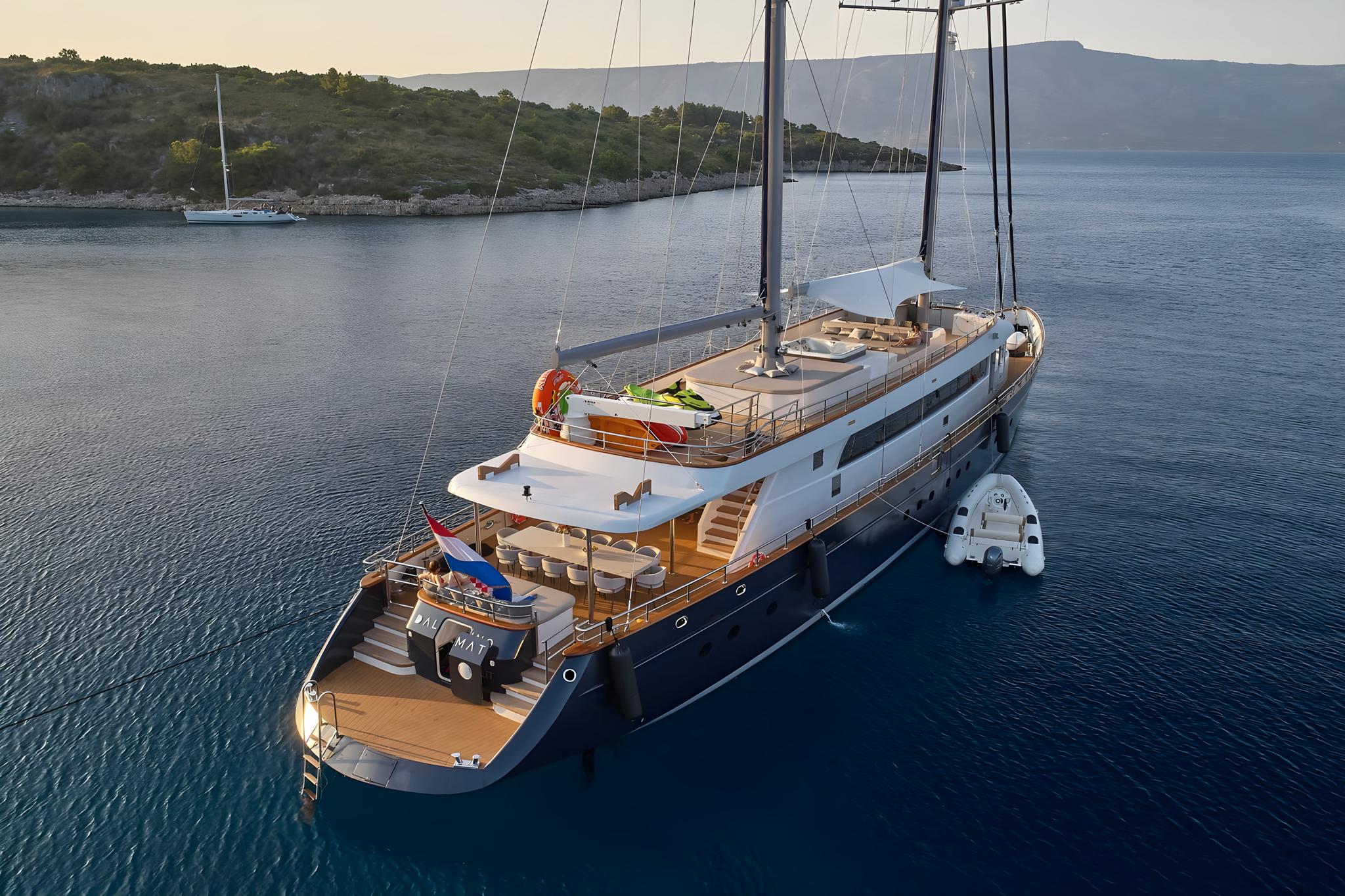 aerial view luxury sailing gulet anchored calm blue Mediterranean waters